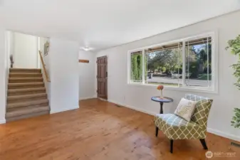 There's a small closet to the left of the front door & the staircase up, behind that ...
