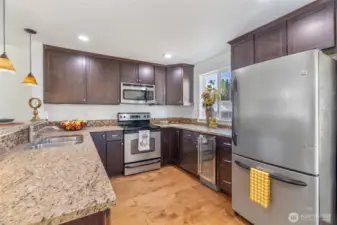 Granite counters, stainless appliances, wine fridge, beautiful lighting, too much too list ...