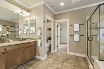 Dual vanities, a huge dual-head shower, and soaking tub - plus a fantastic walk-in closet.