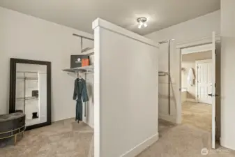 The primary closet is HUGE and includes a separate partitioned dressing space - great for a vanity area or even more storage.