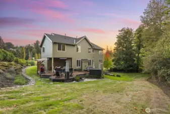 The rolling yard offers abundant space for pets, gardens and play.