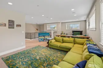 A family/tv room at the top of the stairs.
