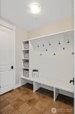Entrance from the 2 car garage. More shelving to hold shoes or hang multiple jackets.