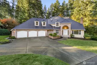 Walk inside the high ceiling entry and begin the exploration of this stunning home.   Circular driveway leads to the huge 880 square foot garage complete with two work benches.   Plenty of room for projects and hobbies here.