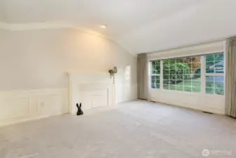 Another view of the formal living room and fireplace.