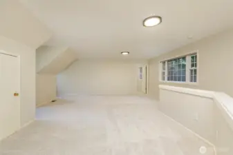 Second view of the bonus room.    The door in the background leads to another giant storage closet complete with shelving.     No need to store your special things in the garage with all this indoor storage.