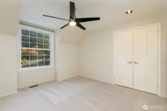 Second bedroom.    There is a lot of new lighting through this lovely house.