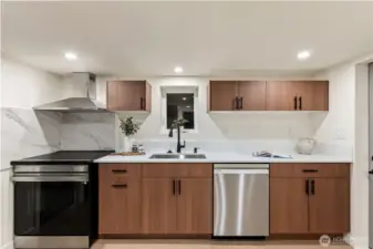 Full size kitchen in basement area.