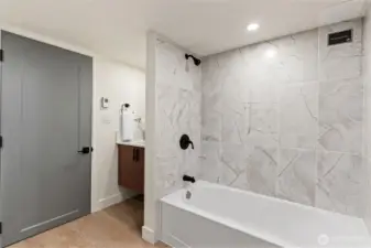 Full bathroom in basement area.