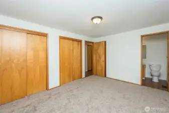 Primary bedroom has 2 closets, half bath and another door into the hydrotherapy walk-in spa tub