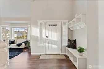 The entry offers an easy, mudroom-like feel with functional space for shoes, coats, and everyday essentials.