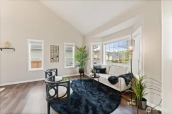 The freshly painted interior is complemented by wood-wrapped windows throughout, filling the home with abundant natural light.