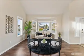 Living & Dining Room:  The combined living and dining room features soaring ceilings that create an open, light-filled space ideal for entertaining or everyday living.