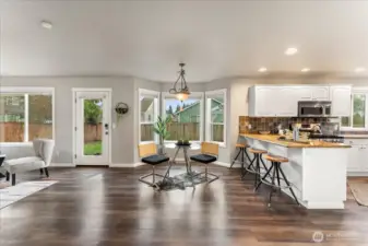 The great room includes an informal dining area that offers a comfortable space for everyday meals and gatherings.