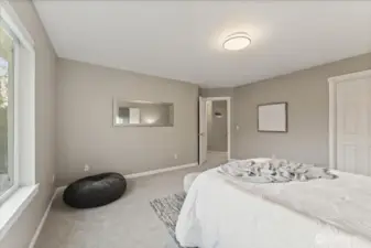 The primary suite blends comfort, softness, and space to create a true retreat within the home.