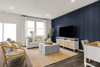 Large open great room with ample room for seating areas. Actual home is under construction. Colors, materials, and features may vary. See site agent for details.