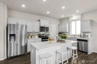 Beautiful modern kitchen space. Actual home is under construction. Colors, materials, and features may vary. See site agent for details.