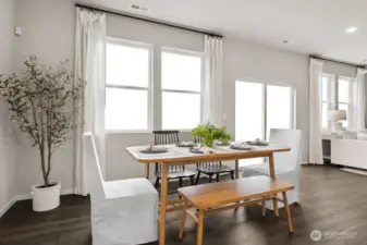 Dining space can accommodate a large table to host dinner parties. Actual home is under construction. Colors, materials, and features may vary. See site agent for details.