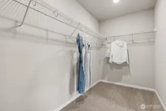 Huge walk-in closet as part of the primary bedroom suite. Actual home is under construction. Colors, materials, and features may vary. See site agent for details.