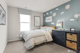 Bedroom 2 offers a cozy sleep space with room for a queen size mattress and more. Actual home is under construction. Colors, materials, and features may vary. See site agent for details.