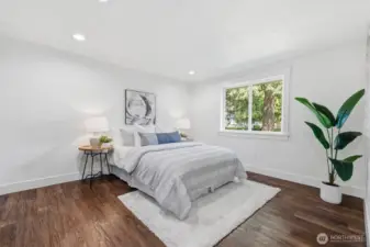 Primary bedroom + ensuite bathroom (staged)