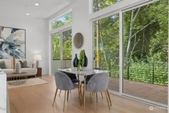 Enjoy meals with serene views through floor-to-ceiling windows that bring the outdoors in.