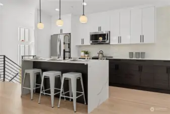 Spacious and modern kitchen island with elegant lighting.