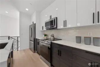 Sleek cabinetry and premium appliances make this kitchen a chef's dream.