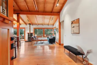 Entryway greats you with stunning woodwork and hardwood floors.