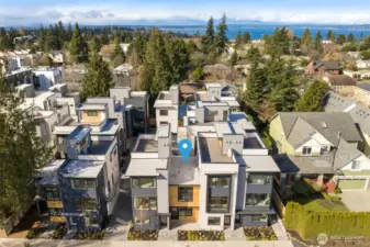 Street view of a thoughtfully designed community featuring bold exteriors and contemporary elegance.