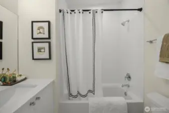 Photos of model home with similar finishes & floor plan.