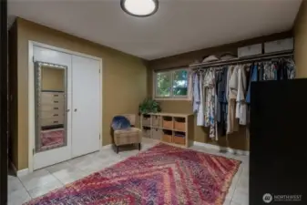 One of two large walk-in closets of off primary bedroom en-suite.