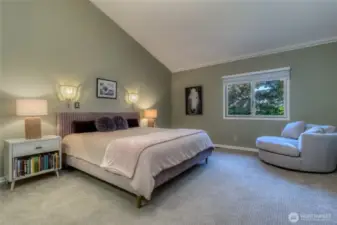 Bedroom suite #2 - located on main level features vaulted ceiling, large walk-in closet and en-suite three quarter bath with dual vanities.