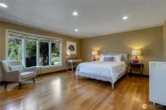 Bedroom suite #3 - located on main level, featuring beautiful hardwoods, coved windows, double closets and dedicated 3/4 bath.