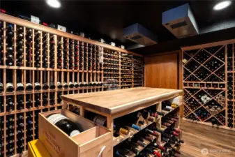 Cellar is temperature controlled with wine cellar specific cooling - dual (redundant) blowers and remote compressor, installed by Grassi.