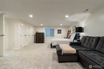 Bedroom suite #4 located on lower level, with legal egress.