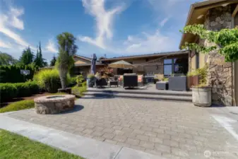 Gas firepit and hot tub located on lower level of back patio. A fun place to gather and enjoy the privacy and beauty of the back yard.