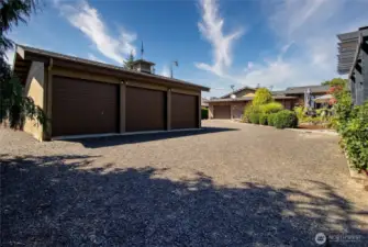 Three bay shop with RV parking on backside, plus additional space for boats and other toys!
