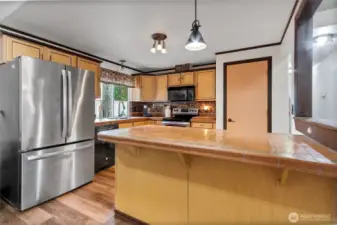 Authentic tiles counters, full tile backsplash, newer lights and faucet