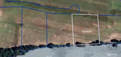 Lot slopes from north to south providing incredible river views and access