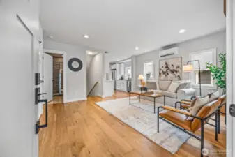 Stunning entry into main living with wide-plank oak flooring throughout.
