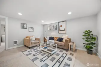 Additional media/recreation room located on lower floor with access to full-fenced backyard.
