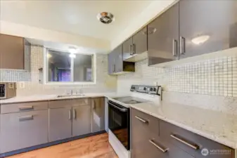 Remodeled kitchen with quartz counters