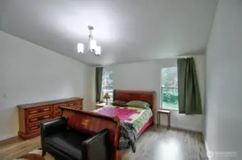 Large primary and en suite with soaking tub and separate shower.