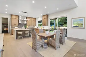 Large kitchen, tons of storage, deep pull-out drawers for pots, pans, and serving trays. In-island microwave and bonus cabinets on the back side of the island. Gorgeous island chandelier. Spacious everyday dining.