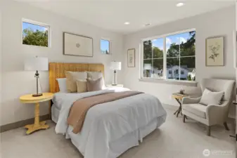 A secondary upper-level bedroom large enough for a queen or king size bed plus two large nightstands, and a desk or dresser plus walk-in closet.