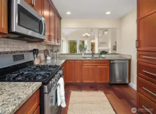 Kitchen looking over eating bar out towards living space.