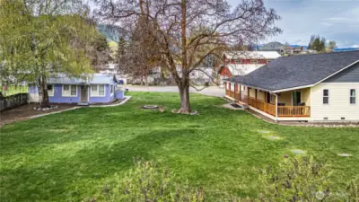 Almost an acre of level, fully fenced, level land with lots of room for gardening, a horse, dogs, parties, lawn games, & entertaining, or just enjoying the privacy of your oasis!