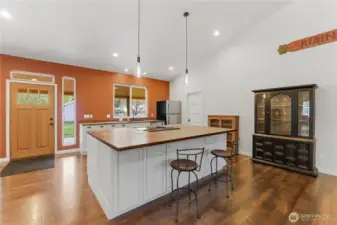 Large kitchen island & open floorplan in the main living room.