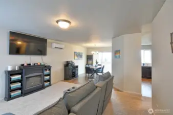 Top of stairs looking into living room dining room and kitchen.